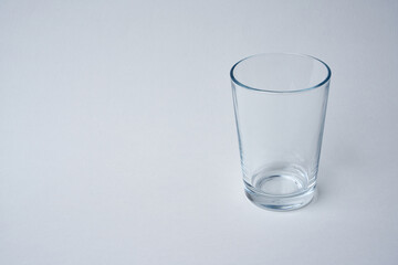 Small water glass on a white background.