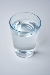 Small water glass on a white background.