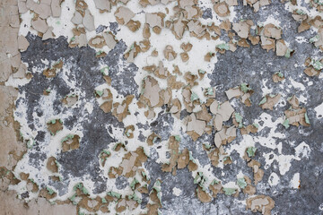 Peeling paint on the wall. Old concrete wall with cracked flaking paint. Weathered rough painted...