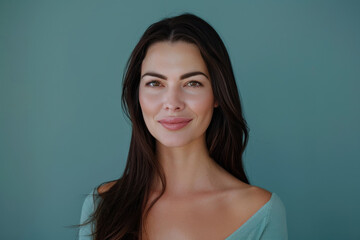 Fototapeta premium A close up portrait of a young woman with a subtle smile