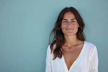 Fototapeta premium A close up portrait of a young woman with a subtle smile