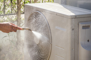 air conditioning compressor outdoor unit cleaning service with water spray