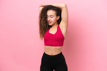 Young Sport Arab woman isolated on pink background