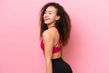 Young Sport Arab woman isolated on pink background