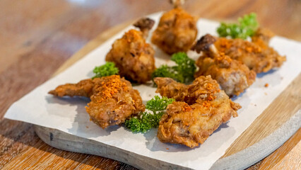 Fried chicken wings garnished with parsley 