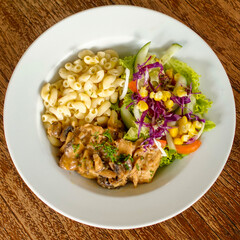 Beef stew with pasta and salad