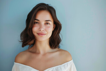 Obraz premium A close up portrait of a young woman with a subtle smile