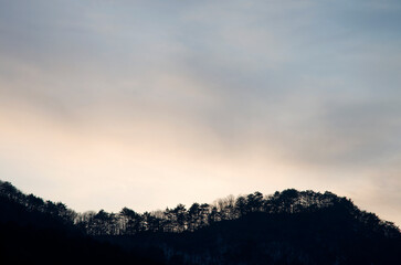The silhouette of the mountain during sunset