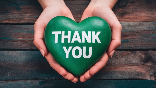 Heartfelt Appreciation Top View of Hand Holding Heart with 'Thank You' Message