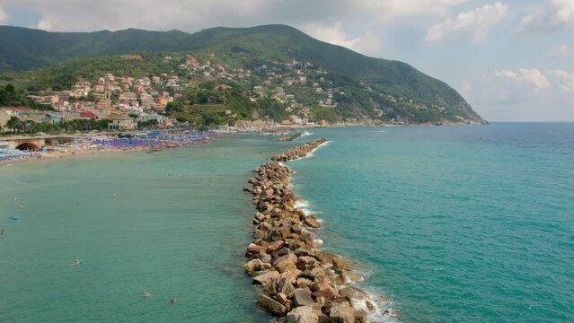 Five Lands, Italy: waves break on the line of rocks in the bay of Moneglia