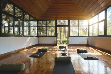 Place for yoga exercises group meditation practices retreats sessions background in natural forest...