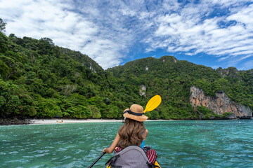 Woman tourist is kayaking at Phi Phi Island Krabi Thailand.