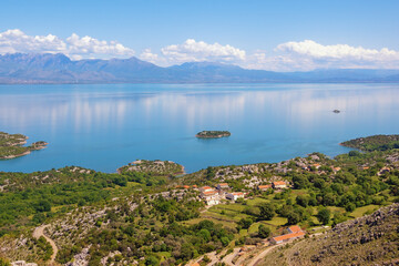 Beautiful sunny summer landscape. View of lake Skadar, karst lake. Montenegro, Albania in distance