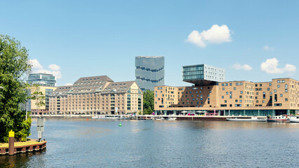 Fototapeta premium waterside urban scene with modern and historic buildings