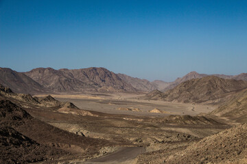 Scenic panoramic view of a valley and desert mountains in Dahab area of Egypt
