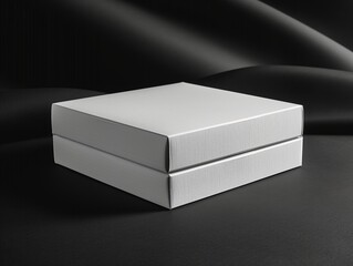 Blank white cardboard box mockup on black surface, ready for branding