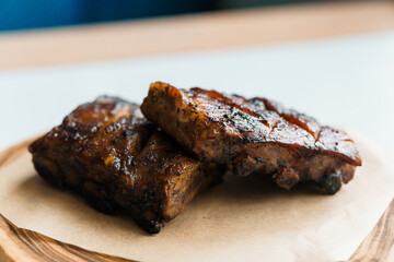 Pork steak with sauce on a wooden board