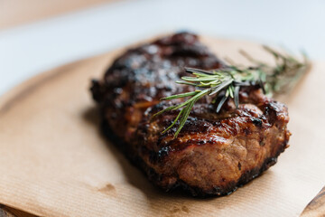 Pork steak with sauce on a wooden board