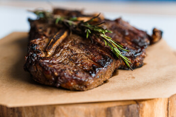 Pork steak with sauce on a wooden board