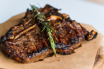Pork steak with sauce on a wooden board