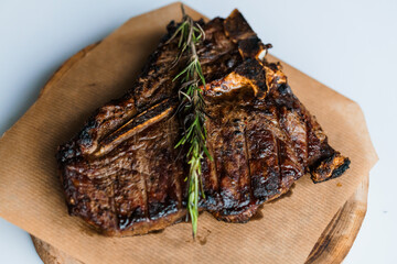 Pork steak with sauce on a wooden board