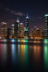 Fototapeta premium A vibrant city skyline at night with lights reflecting.