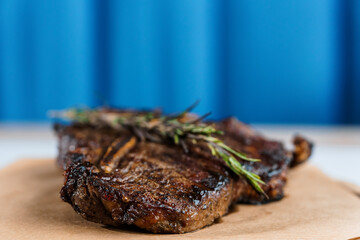 Pork steak with sauce on a wooden board