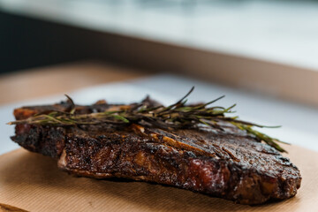 Pork steak with sauce on a wooden board