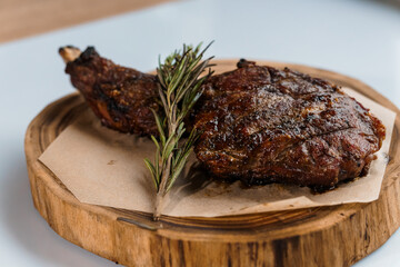 Pork steak with sauce on a wooden board