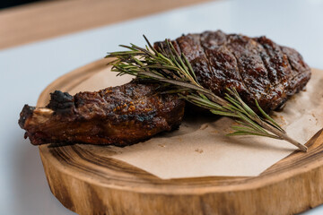 Pork steak with sauce on a wooden board