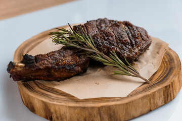 Pork steak with sauce on a wooden board