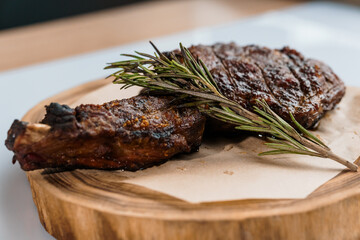 Pork steak with sauce on a wooden board