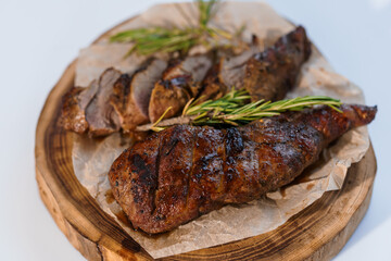 Pork steak with sauce on a wooden board