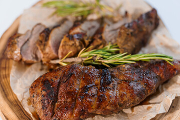Pork steak with sauce on a wooden board