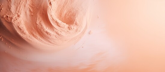 Fototapeta premium Light shade of face powder on a background with plenty of copy space image