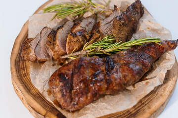 Pork steak with sauce on a wooden board