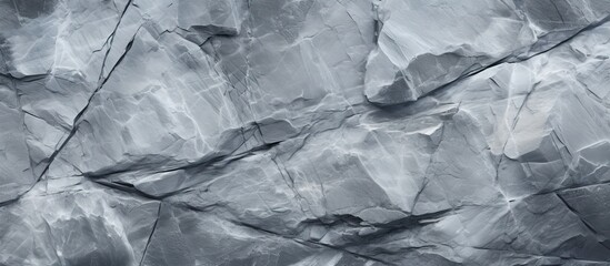 A copy space image featuring a smooth and continuous backdrop composed of fragmented gray marble stone