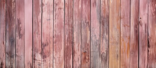 Obraz premium A shabby vertical surface of wooden texture with peeling paint portraying a natural wooden background It is brown with a hint of pink and provides ample copy space for design and decoration Image cre
