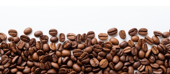 Obraz premium A white background provides ample space for copy alongside a captivating image of roasted coffee beans