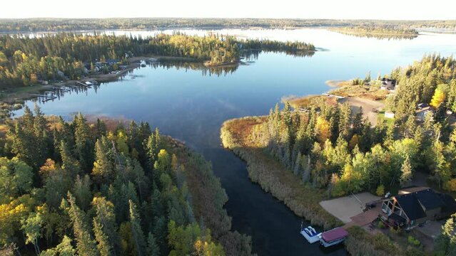 Aerial Drone Video of Emma Lake, SK in Autumn - Vibrant Fall Colors, Scenic Lake Views, and Forests