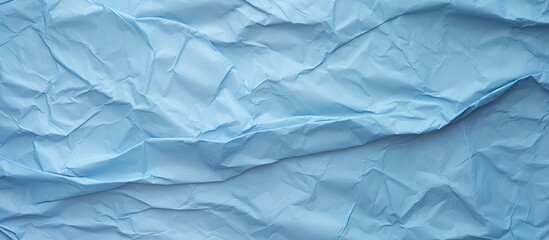 Fototapeta premium blue crumpled paper texture background. copy space available