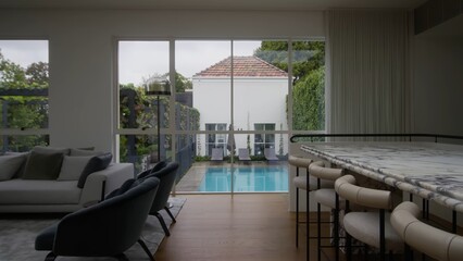 Property Luxurious interior design in the living room of a villa with a swimming pool.