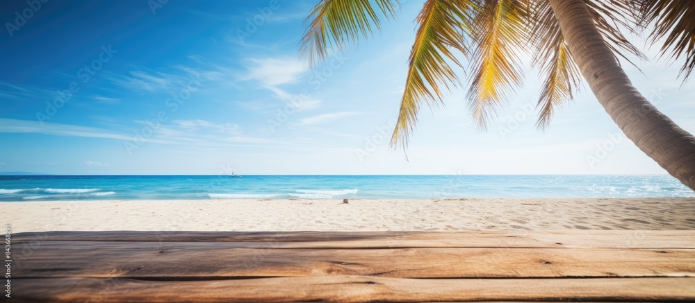 Poster summer beach scene with a palm tree and a wooden platform providing an inviting copy space image