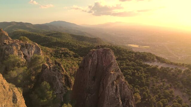 Sportsman rock climbing aerial view of sportsman rapelling mountain in La Panocha, el Valle Murcia, Spain woman rapel down a mountain climbing a big rock