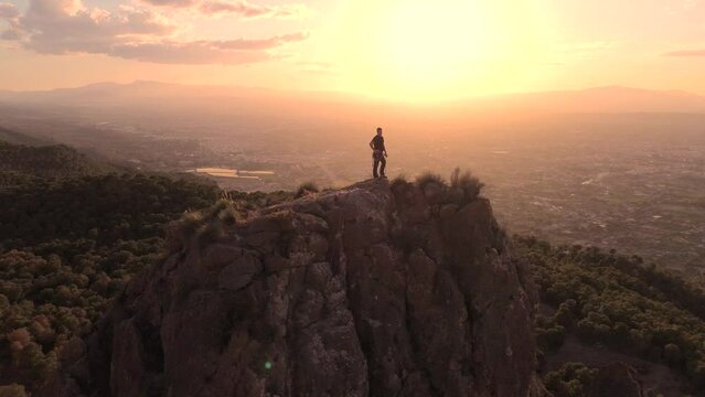 Sportsman rock climbing aerial view of sportsman rapelling mountain in La Panocha, el Valle Murcia, Spain woman rapel down a mountain climbing a big rock