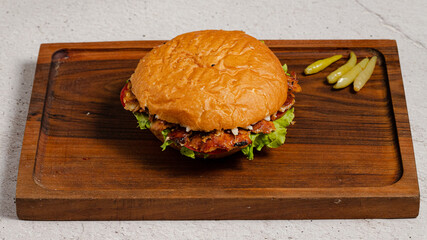 Burger on wooden tray isolated
