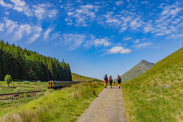 Hikers walking on the West Highland Way, Tyndrum, Scotland. Long distance hiking trail. 