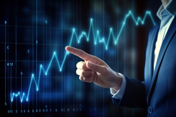Hand pointing at glowing financial chart