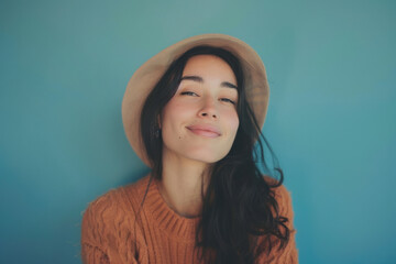 A close up portrait of a young woman with a subtle smile
