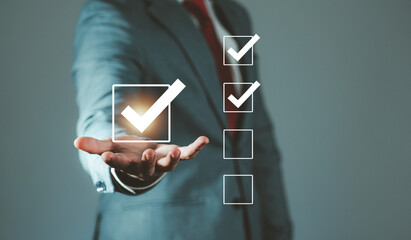 Businessman doing assessments, questionnaires, evaluations, exams, online surveys. Choosing the...